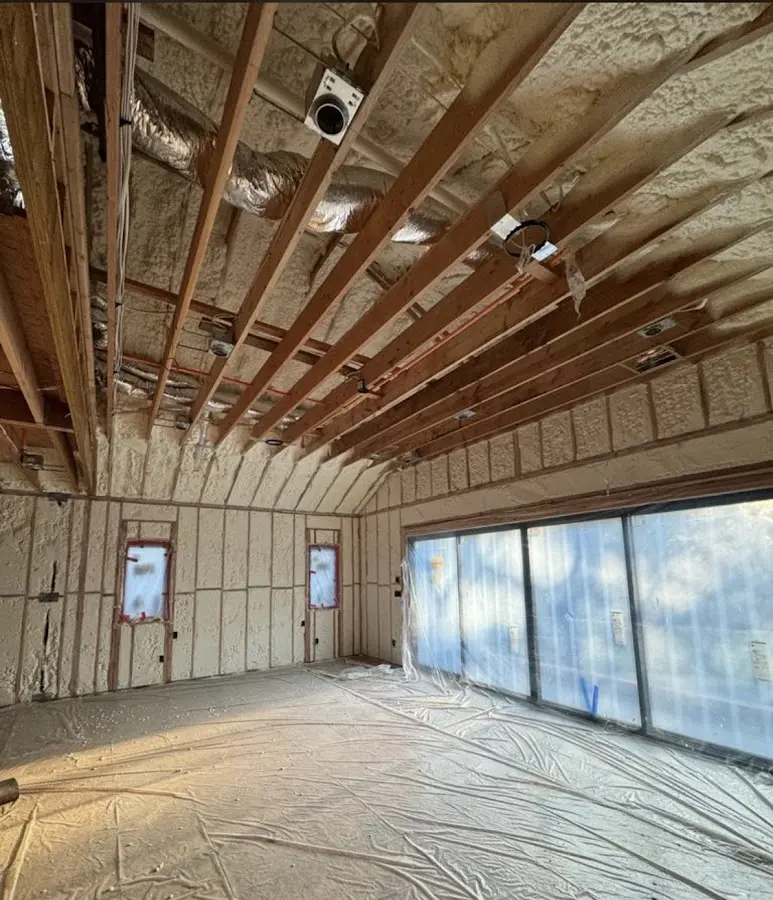 Interior walls and ceiling insulated with spray foam during new construction in Heath